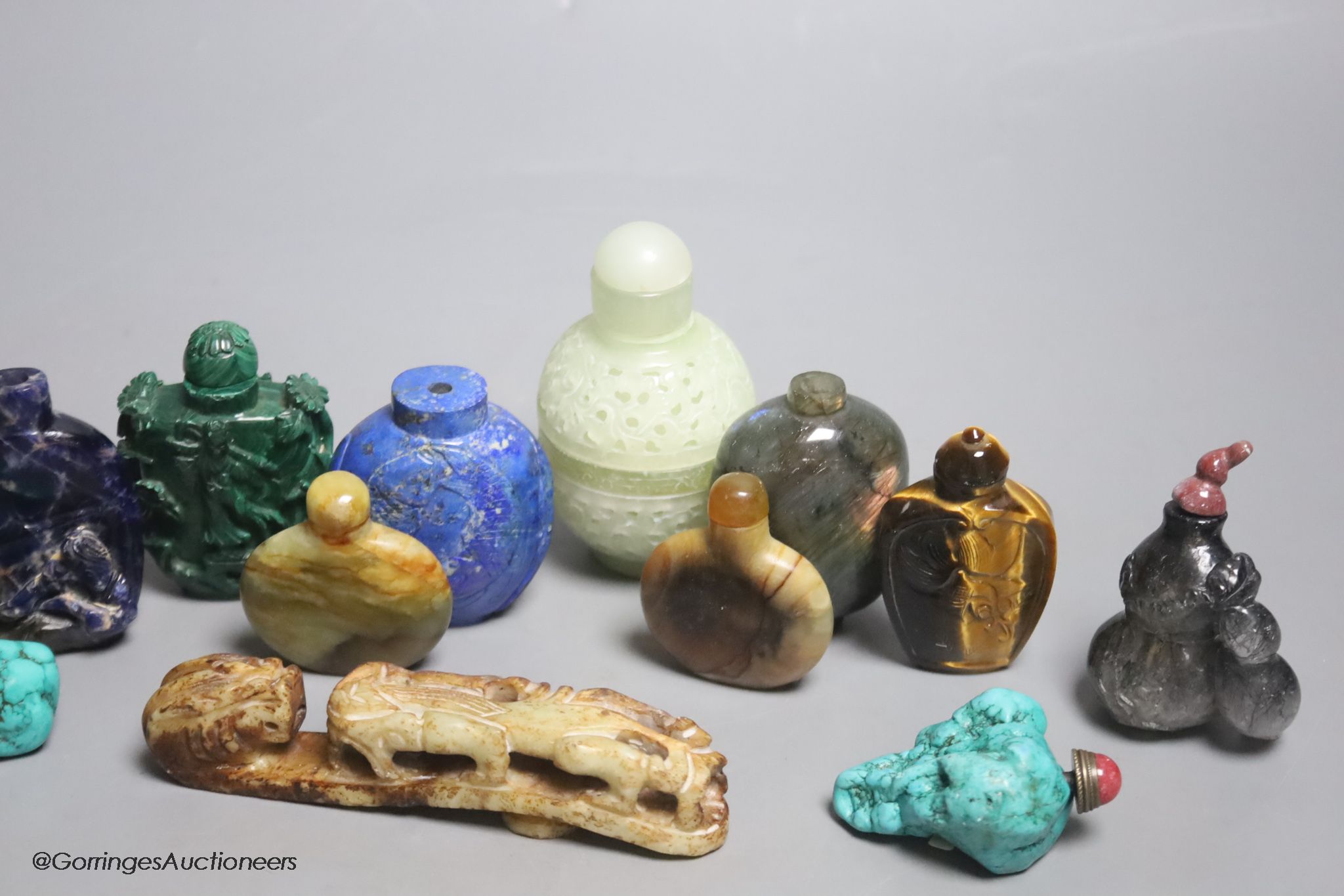 Thirteen mixed Chinese lapis lazuli, turquoise and other carved snuff bottles